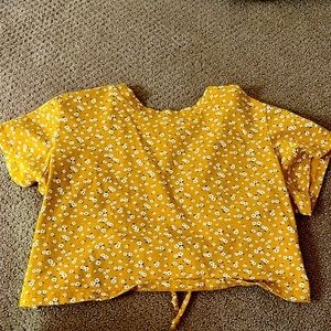 cropped flower tee that is a large in kids but a can also fit a woman’s xs or s